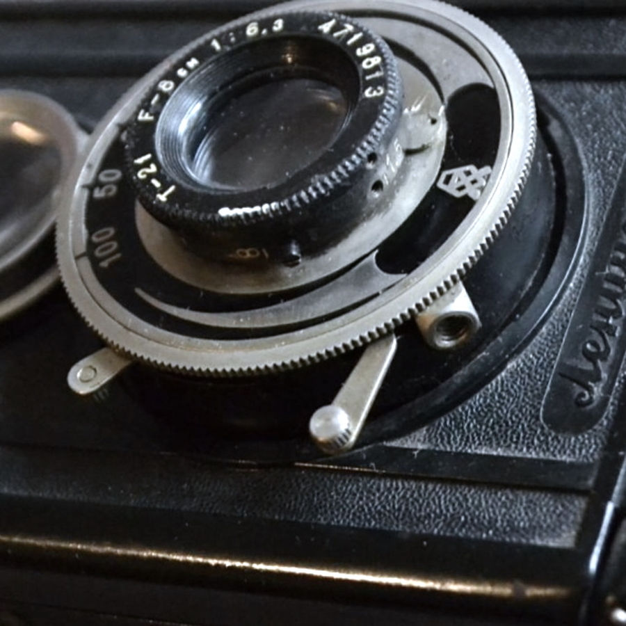 komsomolets camera taking lens and shutter release button close up