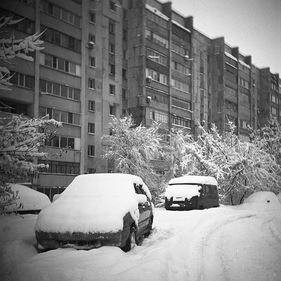 Winter scene with cars in snow captured on Komsomolets TLR camera
