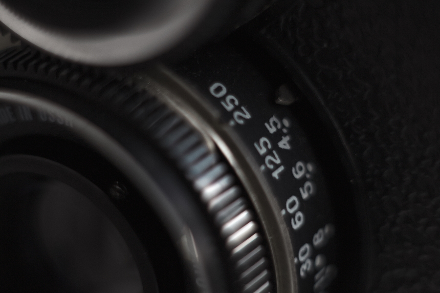 Close-up of Lubitel-166B lens barrel showing shutter and aperture settings