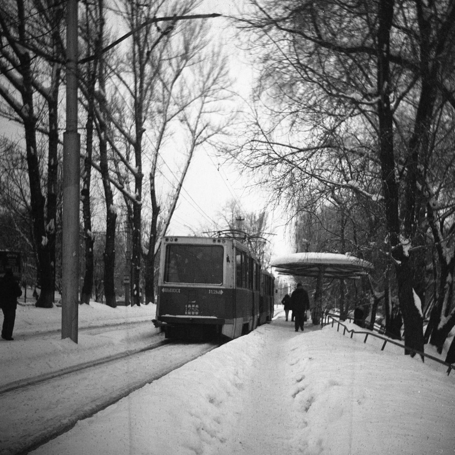 Black and white photo of a train stop shot on a Lubitel 166 tlr camera