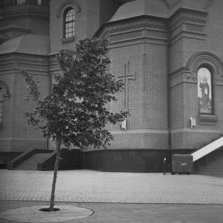Lubitel TLR sample photo showing a church and tree on 120 film