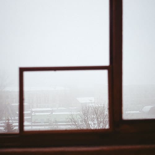 Photo of a city though a frame shot on film