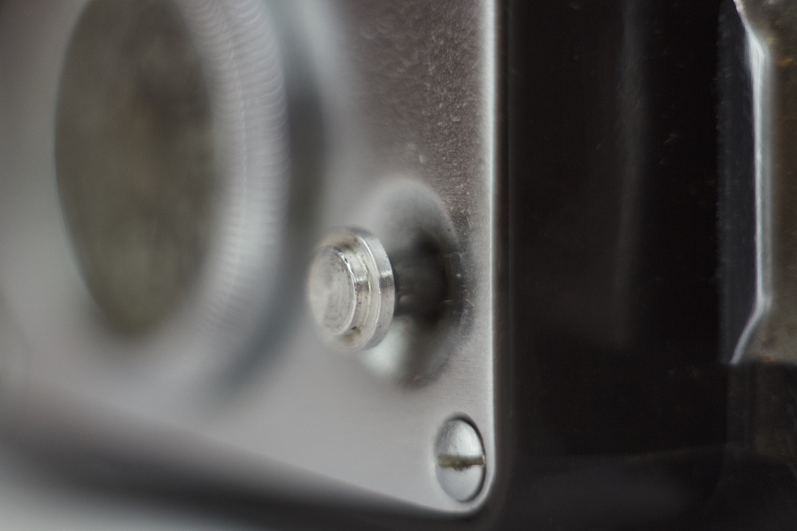 Button on the top page of the film camera