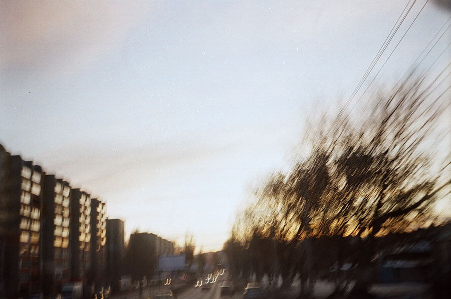 City landscape at sunset shot on a Soviet film camera
