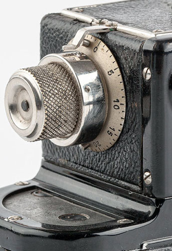 Sport camera film advance and shutter selection knob
