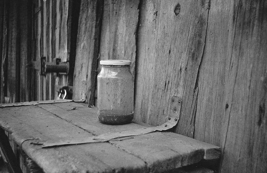 Photo of an old table and jar taken with a Smena-2 camera