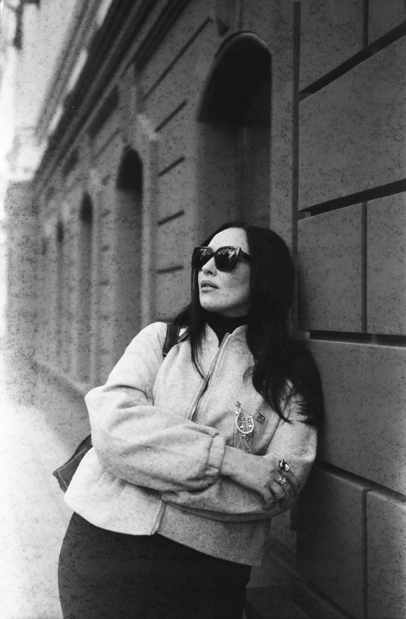 Woman near the wall shot on expired fomapan