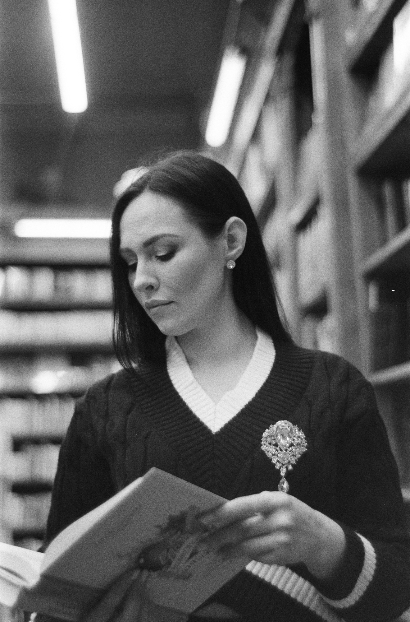 Woman with a book in a library shot on a kiev 3 camera