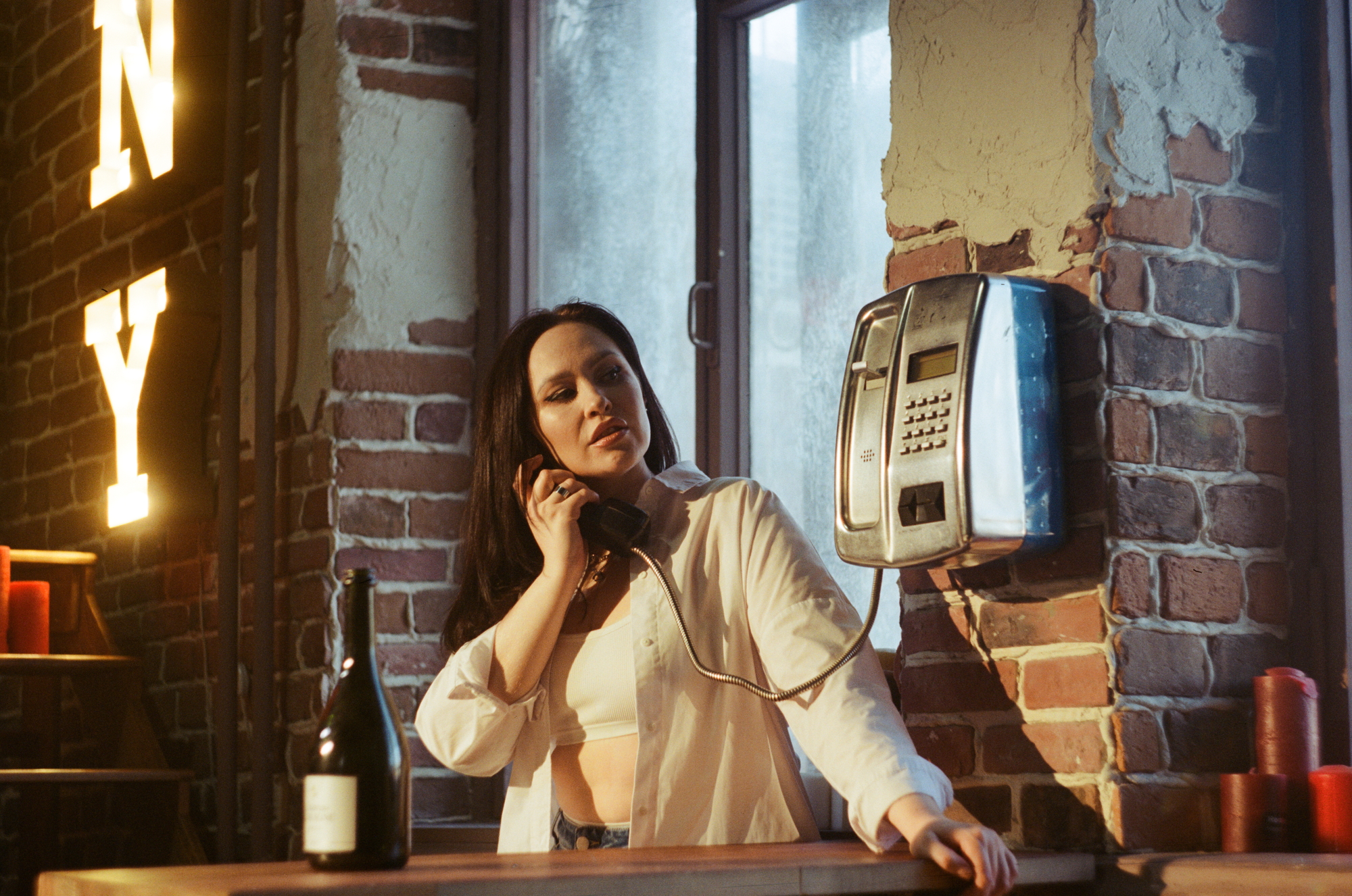 Cinematic shot of a woman with an old phone