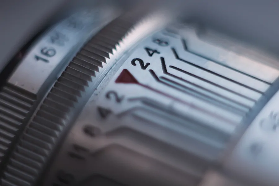 Aperture and distance scales of the Helios lens