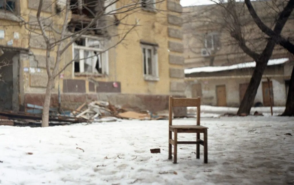 Old house and old chair taken on a Soviet lens
