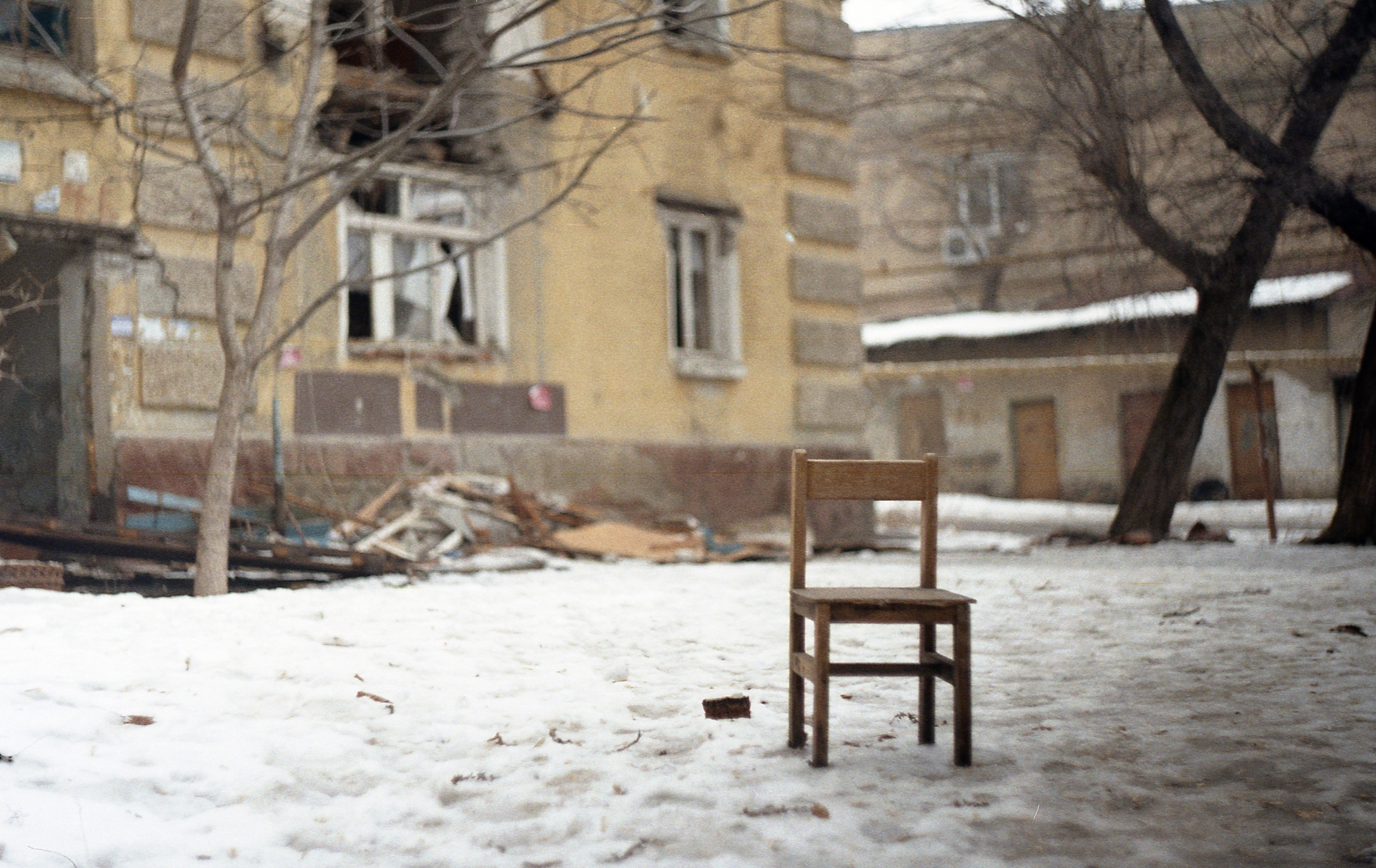 Old house and old chair taken on a Soviet lens