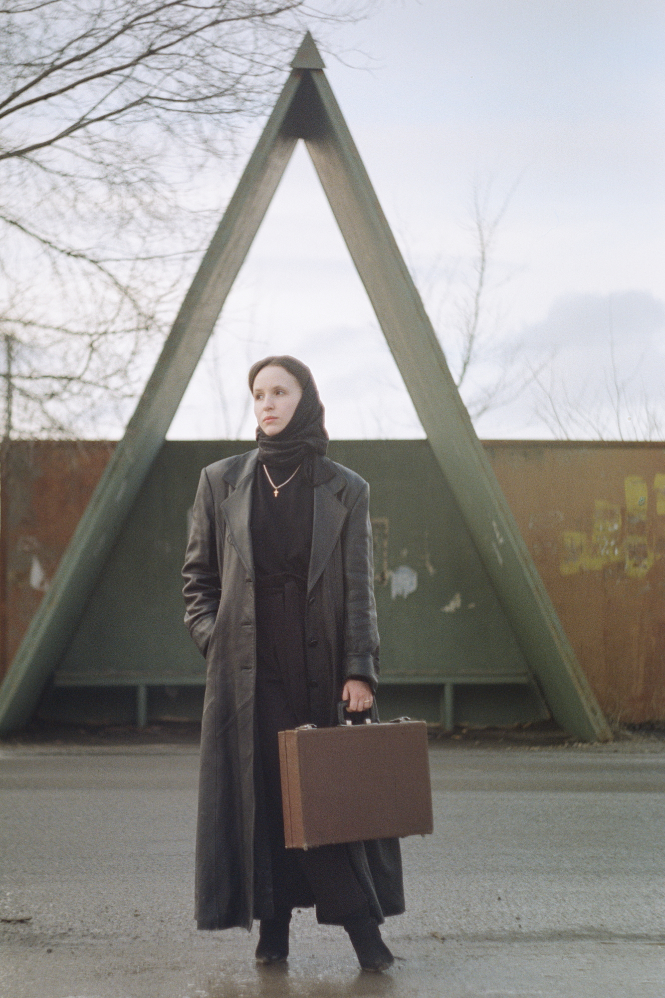 Woman in black with a case shot on a Helios 44 m39 lens