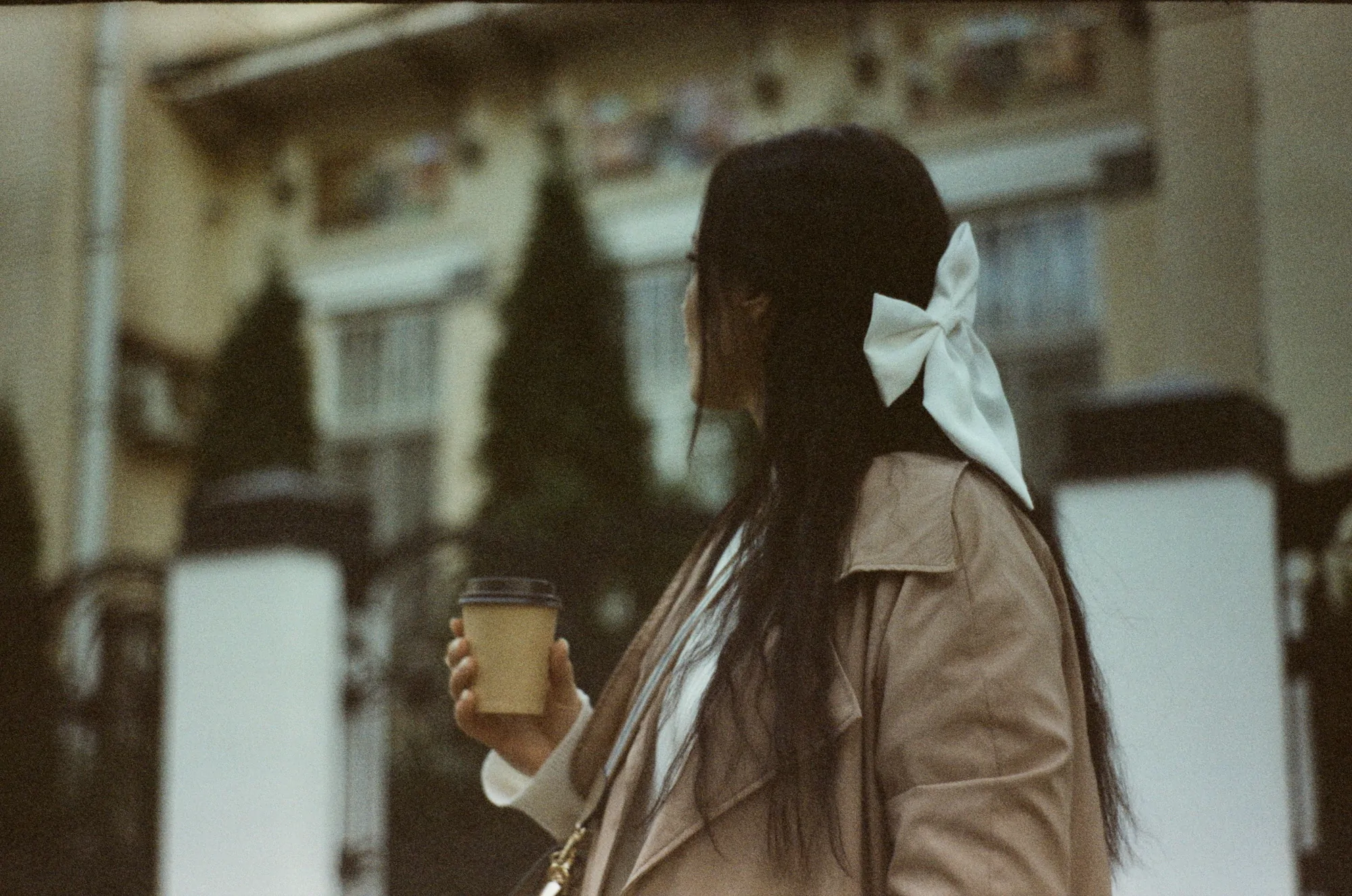 Portrait of a woman with a cup of coffee shot on a Kiev 3 camera