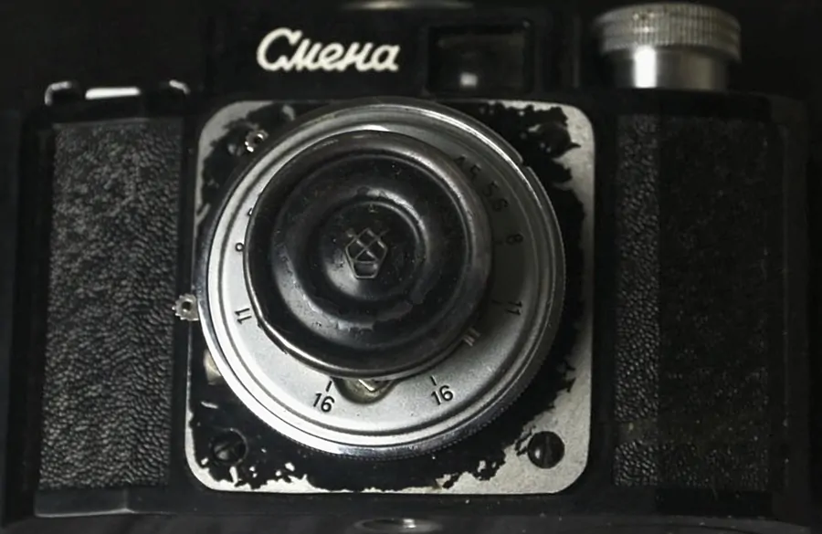 Smena camera and a triplet lens with a cap